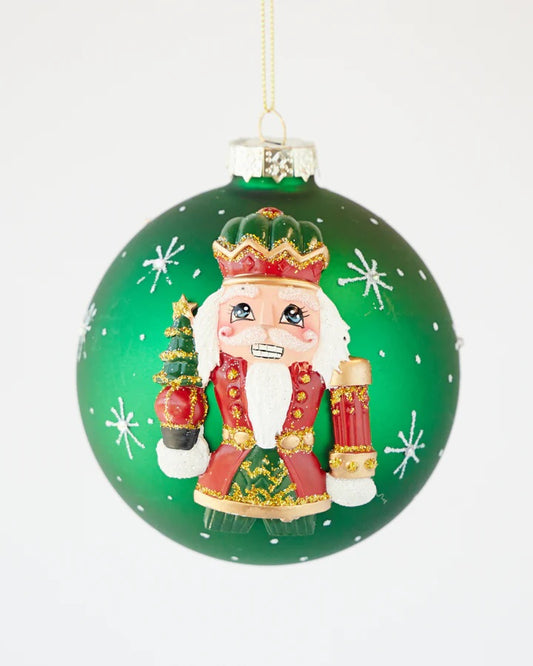 HANDPAINTED NUTCRACKER ON GREEN 10CM GLASS BALL ORNAMENT X2818GR