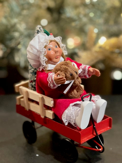 BYERS' CHOICE TODDLER GIRL IN WAGON1821B