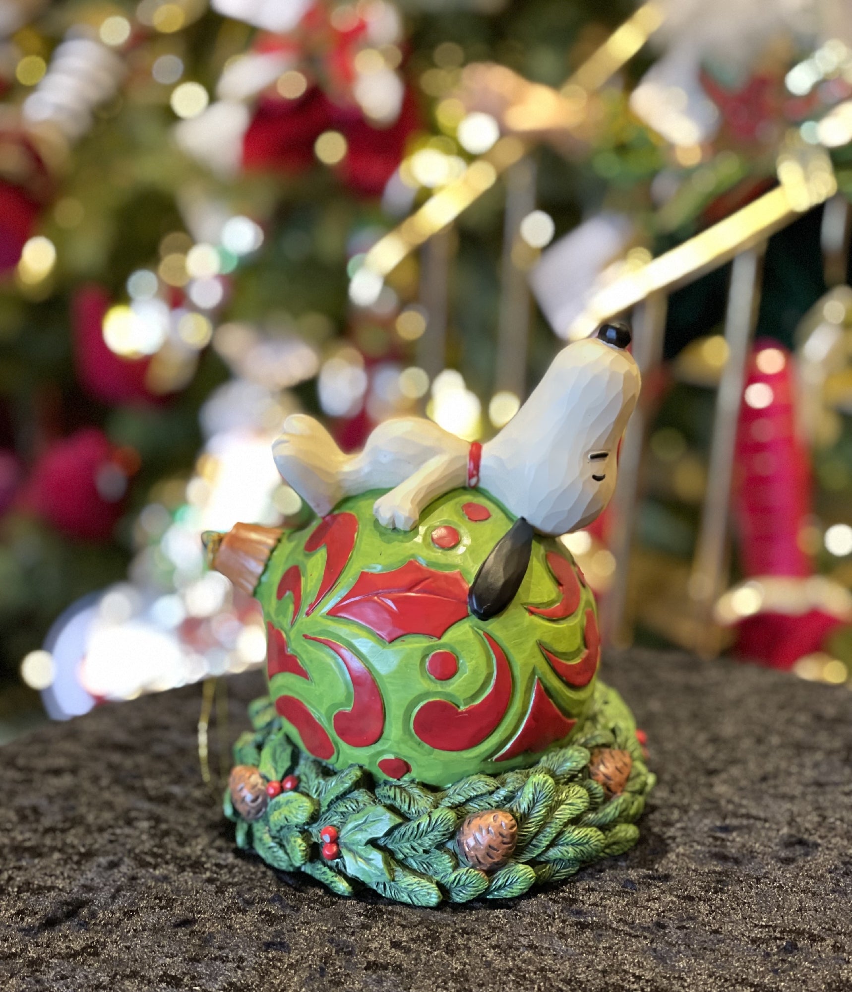 JIM SHORE PEANUTS COLLECTION - SNOOPY LAYING ON AN ORNAMENT, HANGING AROUND 