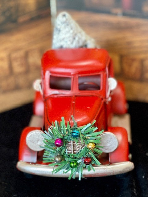 RED OLD STYLE PICK UP TRUCK WITH TREE