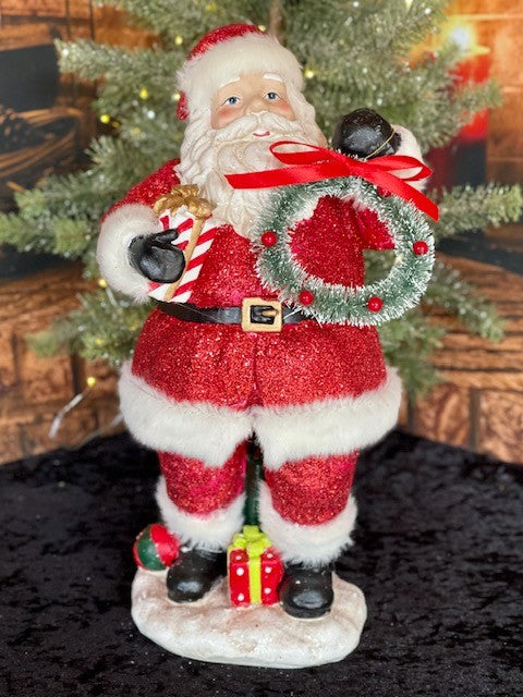 RETRO SANTA WITH BRISTLE WREATH HOLDING GIFT 4116394