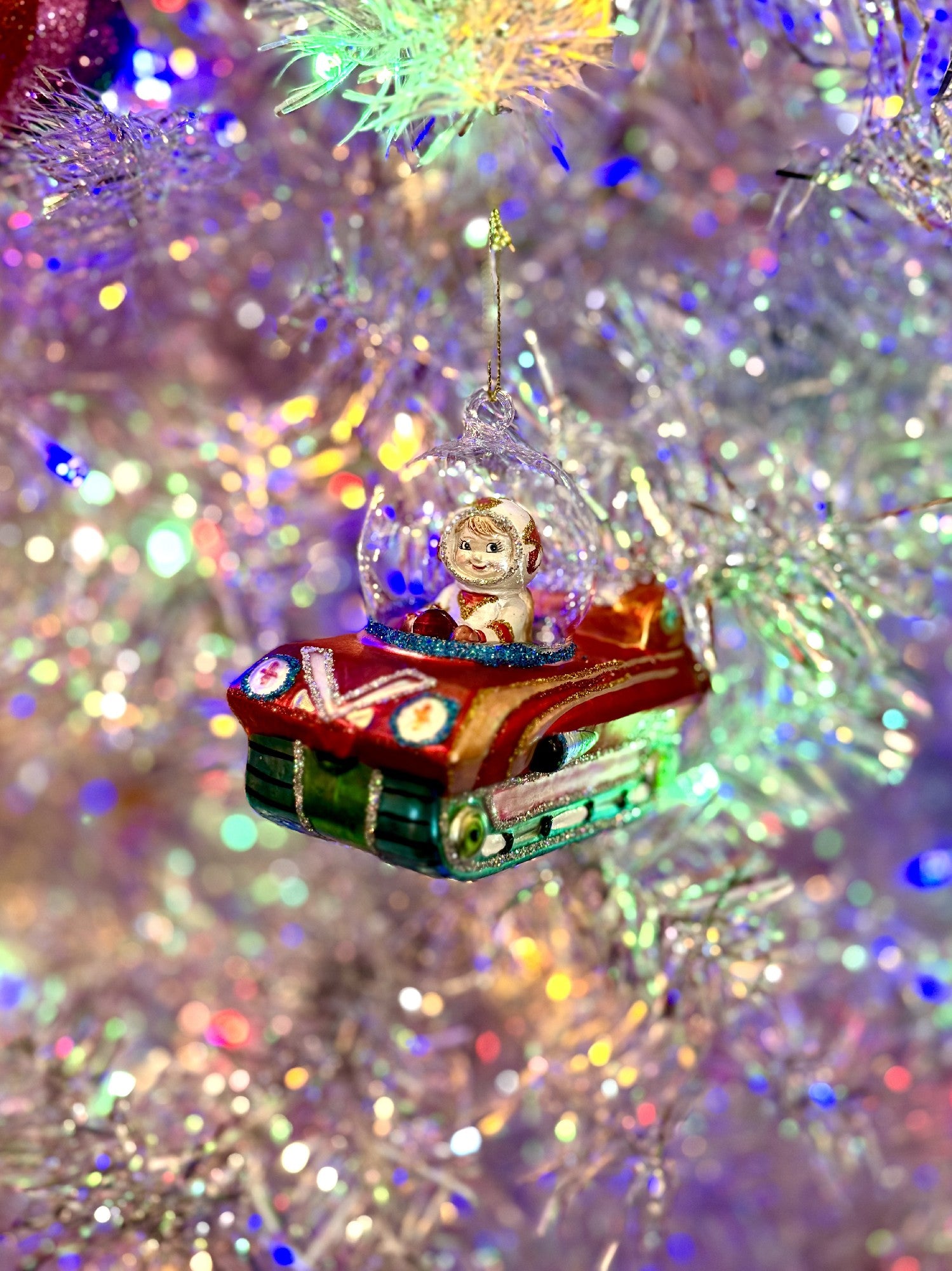 Astronaut in Space Vehicle Glass Christmas Ornament