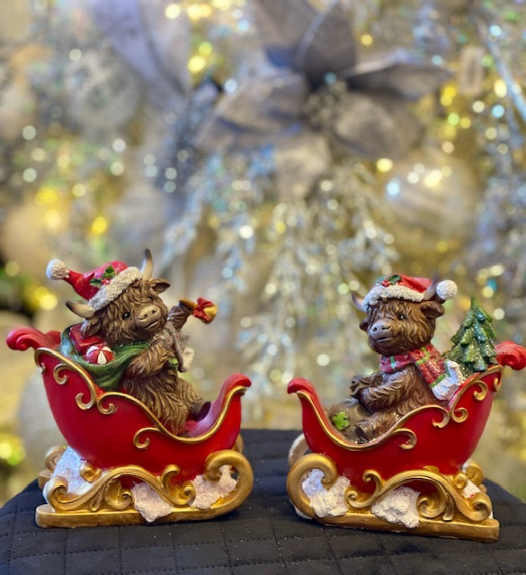 HIGHLAND COW IN SLEIGH WITH BELL 26771