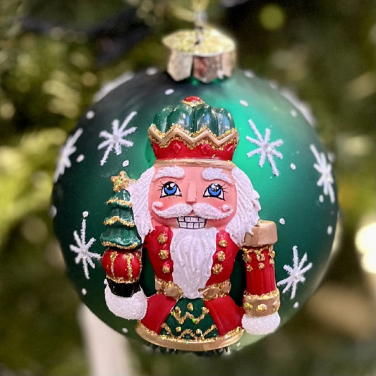 HANDPAINTED NUTCRACKER ON GREEN 10CM GLASS BALL ORNAMENT X2818GR