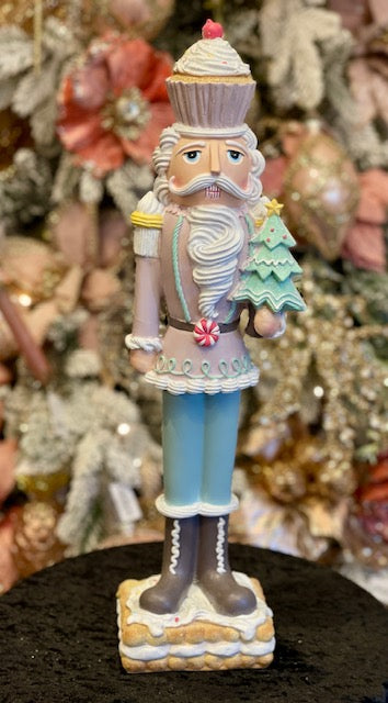 PASTEL GINGERBREAD NUTCRACKER HOLDING TREE RXR403