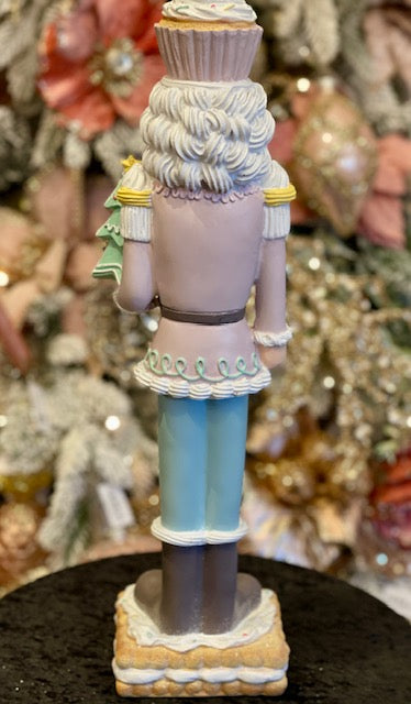 PASTEL GINGERBREAD NUTCRACKER HOLDING TREE RXR403