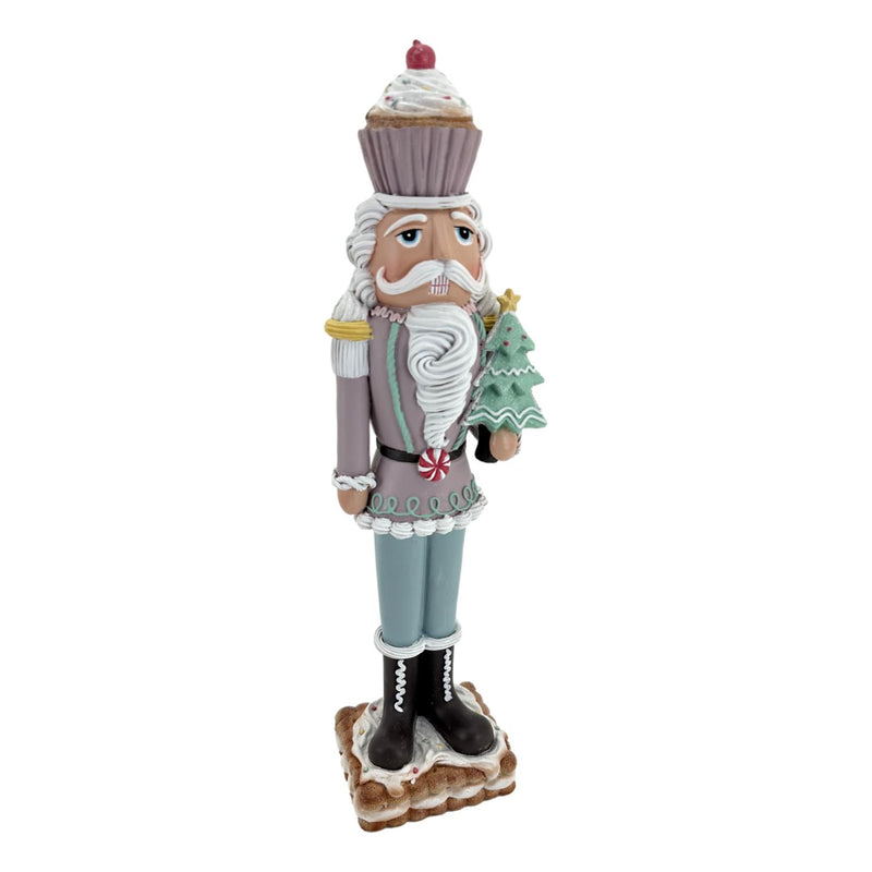 PASTEL GINGERBREAD NUTCRACKER HOLDING TREE RXR403